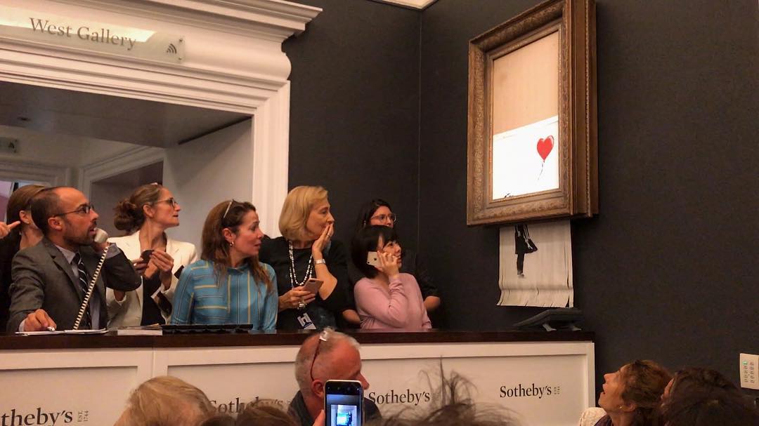 Banksy painting self-destructs after being sold at auction